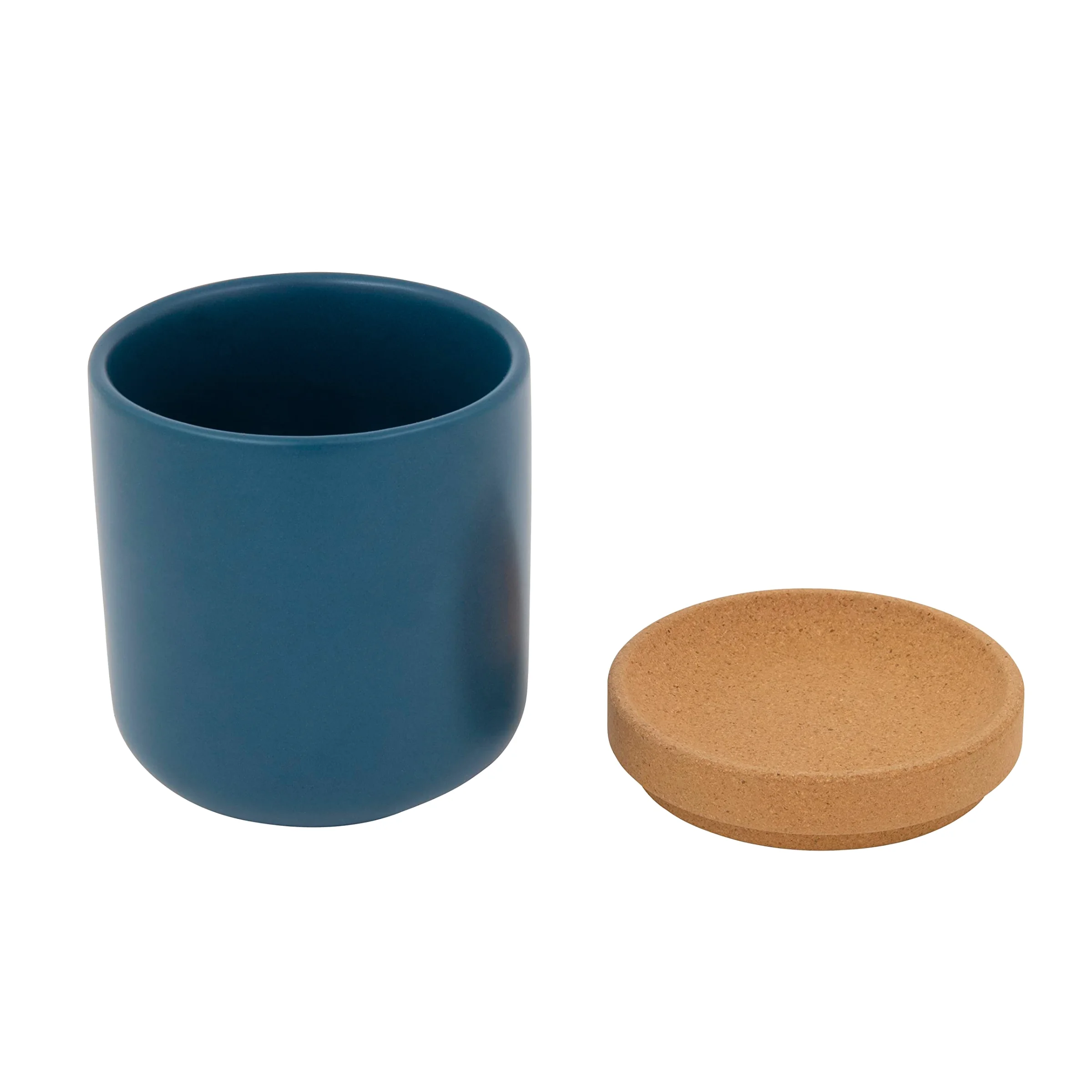 The teal Kamenstein Ceramic and Cork garlic keeper with its curved cork lid set beside it.